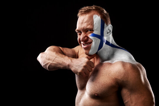 Finland fan. Soccer or football athlete with flag bodyart on face. Sport concept with copyspace.