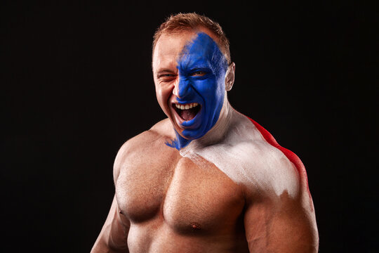France fan. Flag of French Republic. Soccer or football athlete with flag bodyart on face. Sport concept with copyspace.