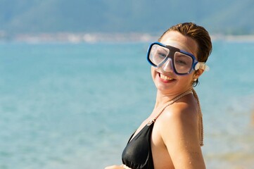 young woman with scuba diving mask