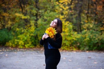 Happy beautiful woman in autumn, cute plus size model outdoors