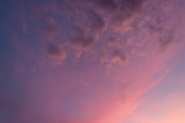 Pink sky with clouds at dawn.