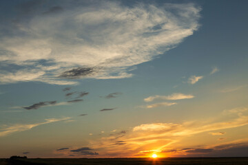 Beautiful atmospheric dramatic clouds in the evening at sunset.