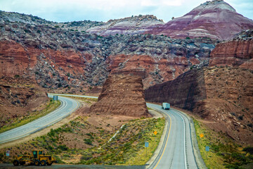 Badlands in Nevada United States with two hunks cut from mountain to make divided highway