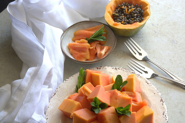 sliced papaya on plate. Plates with fruits. Tropical fruit 