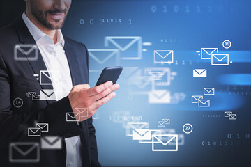 Businessman using phone smiling, background of mails and binary code