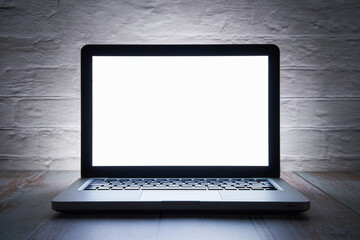 White screen on a laptop at night. Home office till deep in the night.