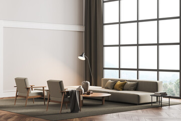 Copy space mockup wall in villa living room design interior, beige furniture on bright wall, wood floor, armchair, couch with lamp. Concept of relax. Panoramic window.