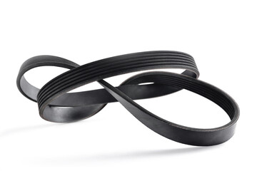 A new belt for a poly-V-ribbed electric generator. Car timing belt. Selective focus