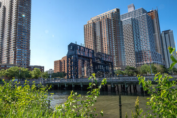 Long Island City, NY - USA- June 13, 2021: A view of Gantry Plaza State Park, with transfer bridges, support gantries, and piers. on the East River in the Hunters Point section of Long Island City.