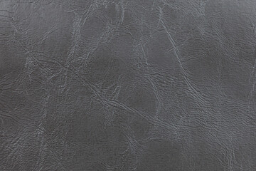 Background image - dark gray leather with textured abstract pattern