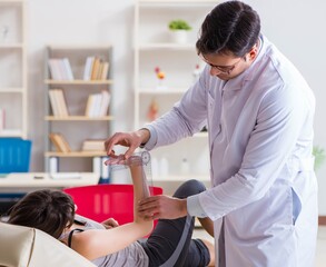 Doctor checking patients joint flexibility