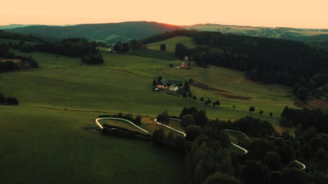 Rural green hills of Schwartenberg mountain at early sunrise, Germany
