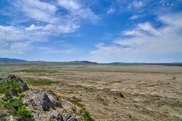 Scenic View of Utah Desert Mountain Rocky landscape with blue skies and white clouds