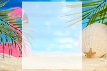 Foto op Canvas Summer beach concept with white place copy space. Seashell, a starfish and an inflatable pink flamingo on a sandy seashore against a background of palm leaves and sun reflections on the water. © NikonLamp