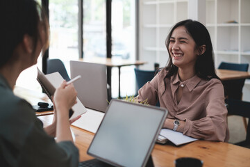 At the company's headquarters. Happy business teams work and talk in private meeting rooms