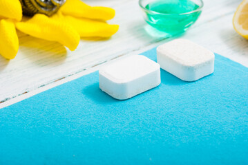 dishwashing products on white wood table