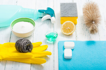 dishwashing products on white wood table