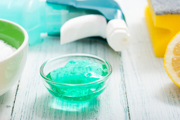 dishwashing products on white wood table