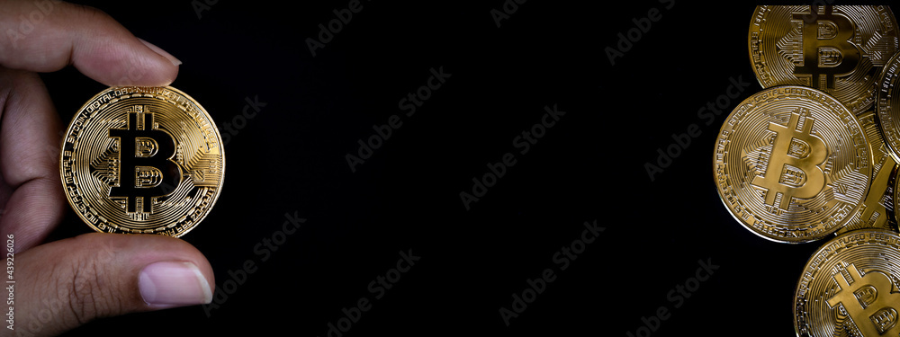 Poster bitcoin technology banner background. close-up golden bitcoin in businessman's hand and gold coin st