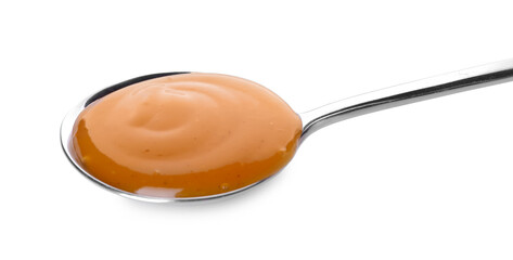Spoon with tasty apricot jam on white background