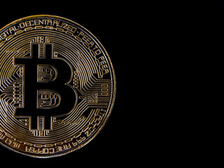 Bitcoin technology dark background. Close-up golden bitcoin on black background with copy space, cryptocurrency investment concept. Digital future coin currency financial background.