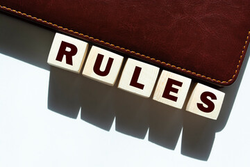 Wooden Blocks with the text: Rules
