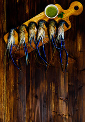 Close up top view shot of raw fresh delicious tasty yummy material big river tiger prawns with blue...