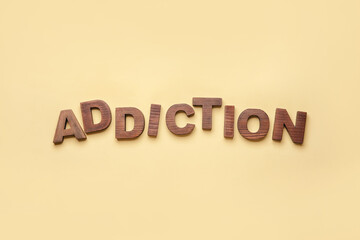 Word ADDICTION on color background