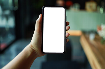 Women's hands holding cell telephone blank copy space screen. smart phone with technology concept