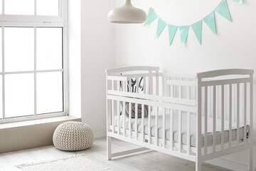 Interior of stylish children's room with comfortable bed