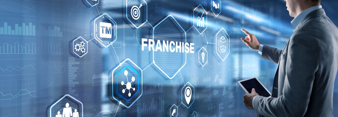 Businessman hand touching inscription Franchise marketing system