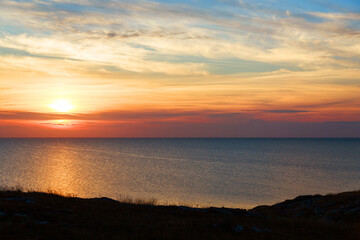 the concept of weather observation, meteorology. wind and small waves. Seascape, mountains and sunset