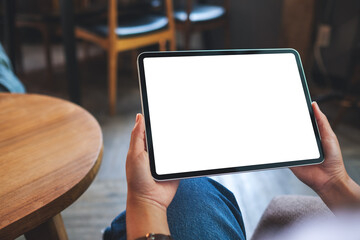 Mockup image of a woman holding digital tablet with blank white desktop screen