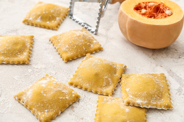 Raw ravioli on light background, closeup