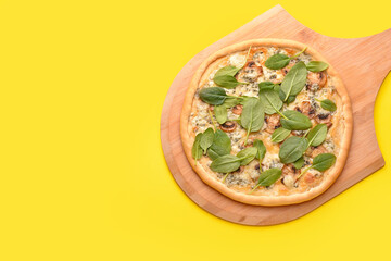 Pizza with mushrooms and spinach on color background