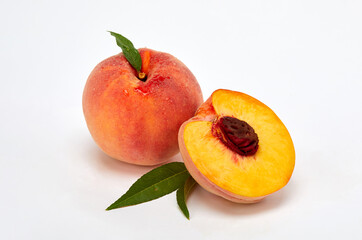 Fototapeta na wymiar Fresh peaches and leaves