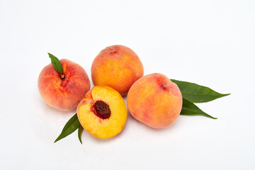 Fresh peaches and leaves
