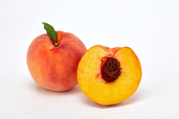 Fresh peaches and leaves