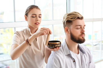 Reiki master working with patient