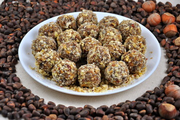 Homemade candy made from nuts on a white plate.