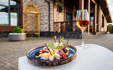 cheese plate and glass of wine
