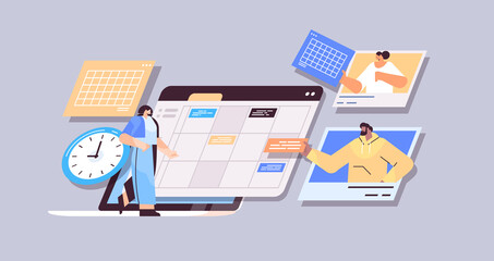 Fototapeta premium businesspeople planning day scheduling appointment time management teamwork concept