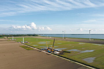Construction of the new wind turbine park in Almere Pampus, Flevoland, The Netherlands. Aerial...
