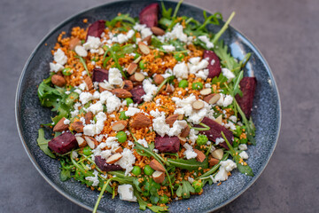 healthy home made couscous salad with sweet potato, beetroot and feta cheese