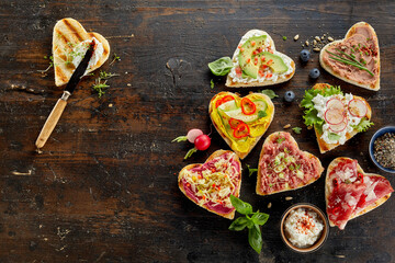 Tasty open sandwiches in shape of heart