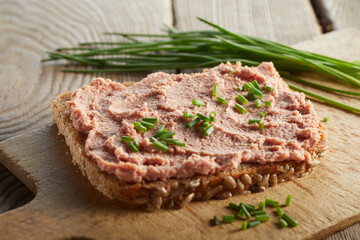 Yummy open sandwich with liver pate on table