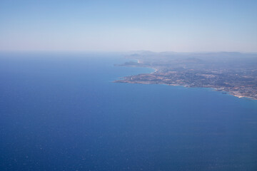 Fototapeta na wymiar Rhodes island view from airplane window, horizontal, top view.
