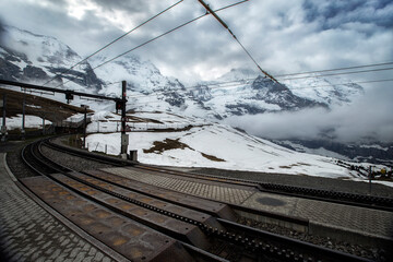 View along the railway from Interlaken to Jungfraujoch In cloudy day at Switzerland