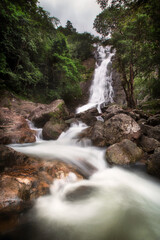 Fototapeta premium Beautiful Waterfall in Thailand. River stream flowing over rock formations in the mountains