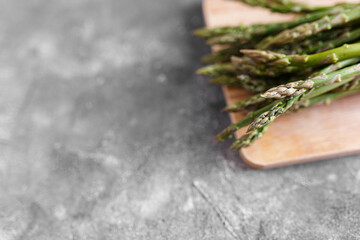 Asparagus. Fresh green asparagus on grey background. Top view copy space.